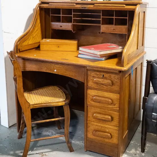 vintage oak single pedestal roll-top desk on metal casters - slide and 3 pedestal drawers, 2 small interior drawers,