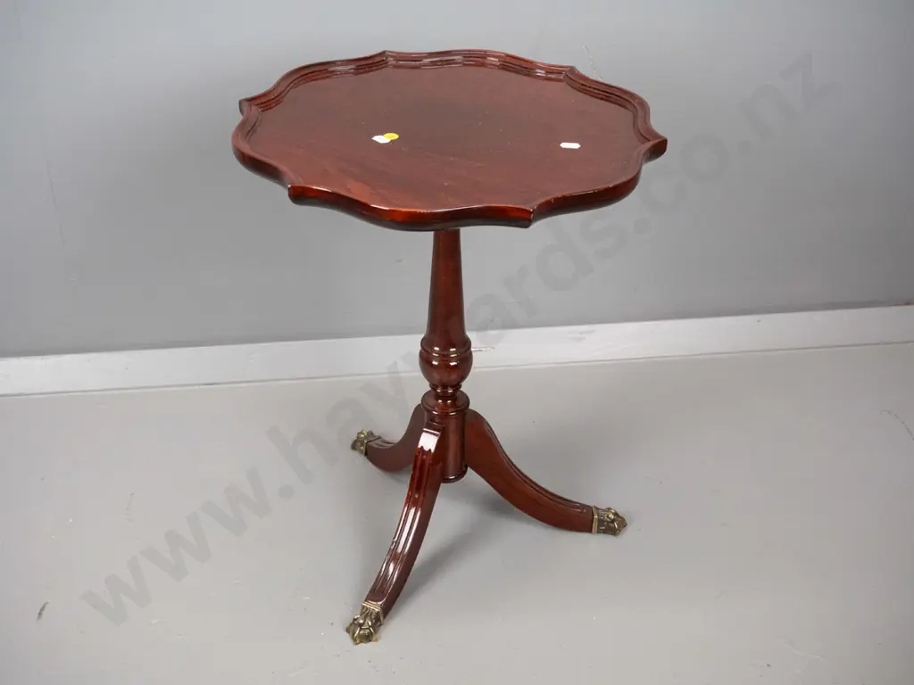 reproduction mahogany wine table with shaped moulded top, turned pedestal w/3 sweeping legs, brass paw feet H500 D400 Image 1++