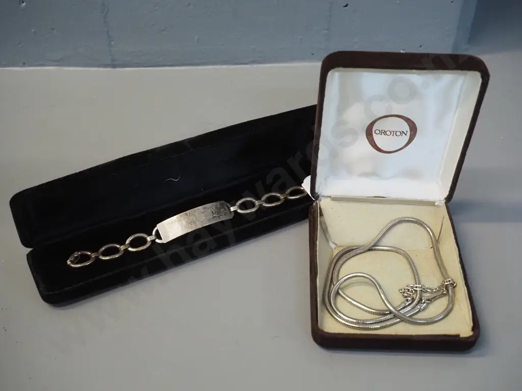 sterling silver chain bracelet marked S.W. STGSIL and a cased Oroton necklace Image 1++