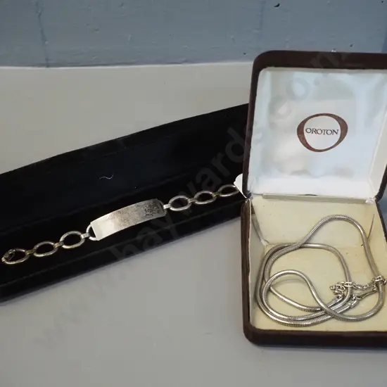 sterling silver chain bracelet marked S.W. STGSIL and a cased Oroton necklace