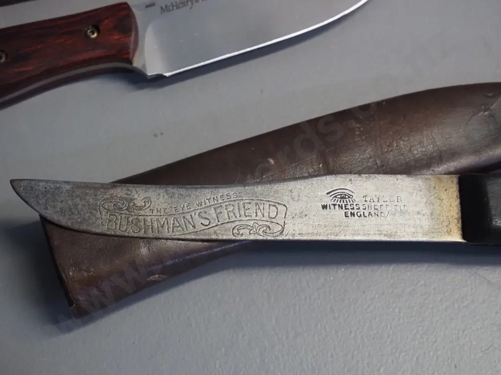 2 timber handled knives in leather sheaths - vintage Taylor Witness Sheffield Bushman's Friend L-260 and a more modern Image 1++