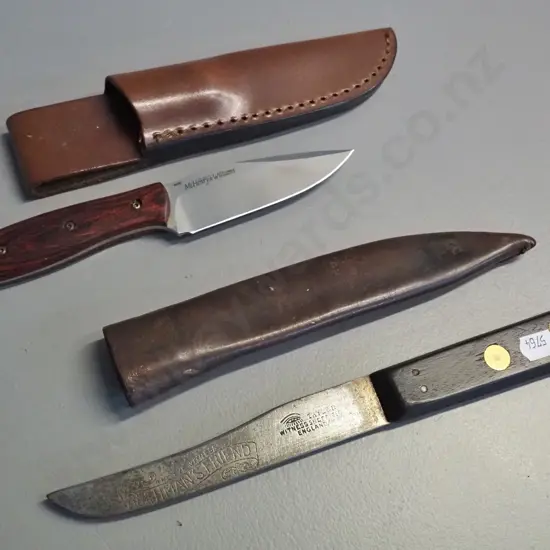 2 timber handled knives in leather sheaths - vintage Taylor Witness Sheffield Bushman's Friend L-260 and a more modern