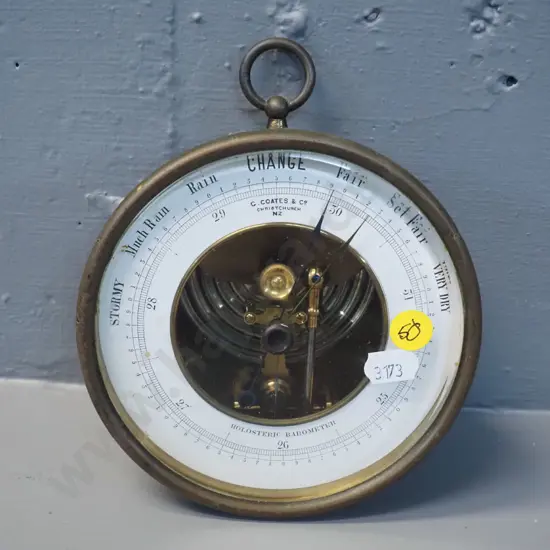 brass cased holosteric barometer, with wall hanging loop, marked "G. Coates and Co Christchurch" Diameter 130