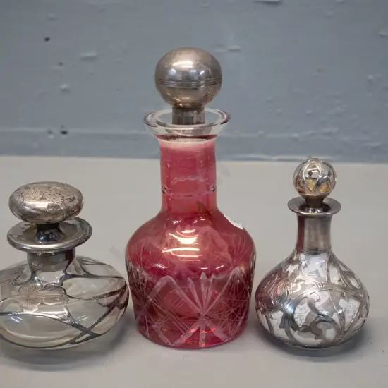 3 vintage scent bottles - 2 clear glass with monogrammed silver filigree overlay, smaller one marked 999/1000, taller is