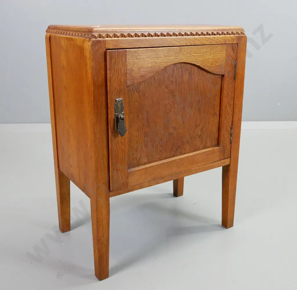 art deco oak bedside cabinet w. panelled door, drop handle, one shelf, square tapered legs. H-620 W-470 D-300 Image 1++
