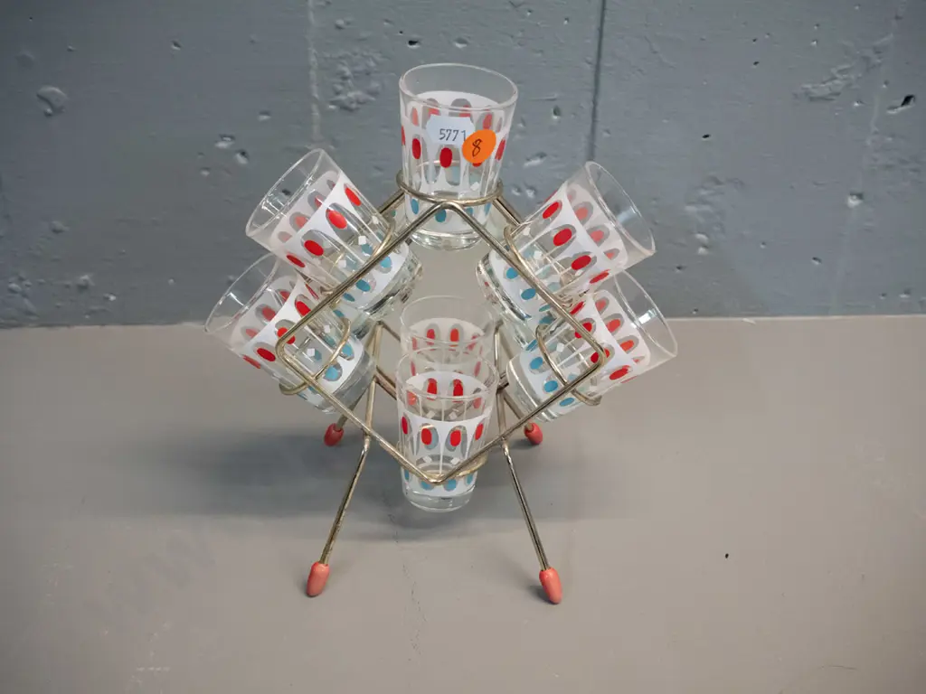 mid-century set of 6 shot-glasses in metal stand with mirrored back H-200 W-200 Slightly bent frame, one leg raised Image 1++