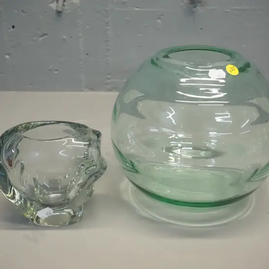 2 clear glass vases - large globe shaped H-210 D-220, and smaller heavy abstract shape. Larger has slight rough edge