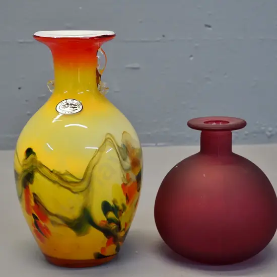 2 glass vases - multi coloured marked TGK H-200 and a matte finish wine-coloured