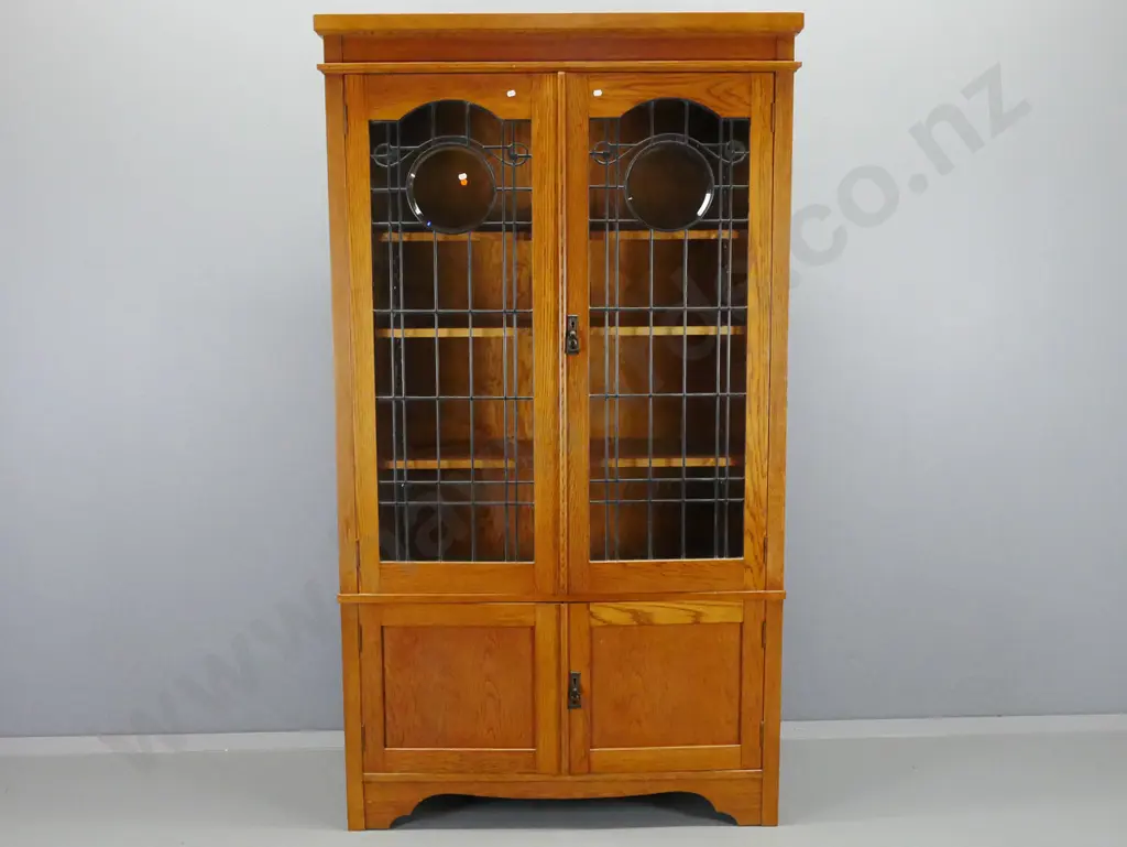 Oak arts & crafts style display cabinet with 2 leadlight cupboard doors, 3 shelves, 2 lower Image 1++