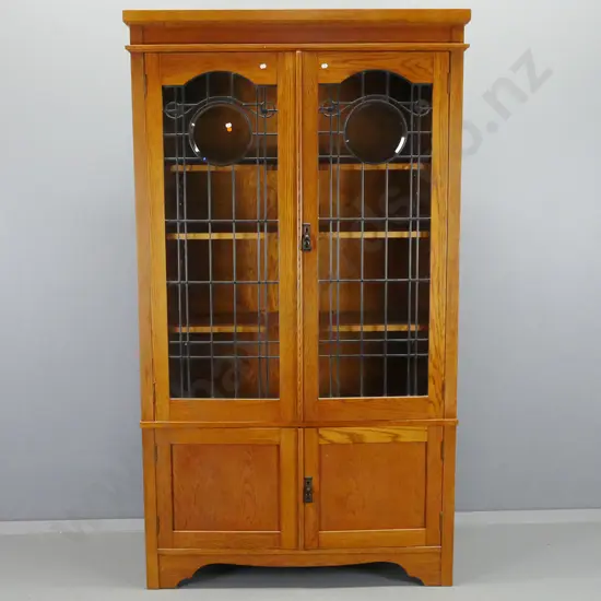 Oak arts & crafts style display cabinet with 2 leadlight cupboard doors, 3 shelves, 2 lower