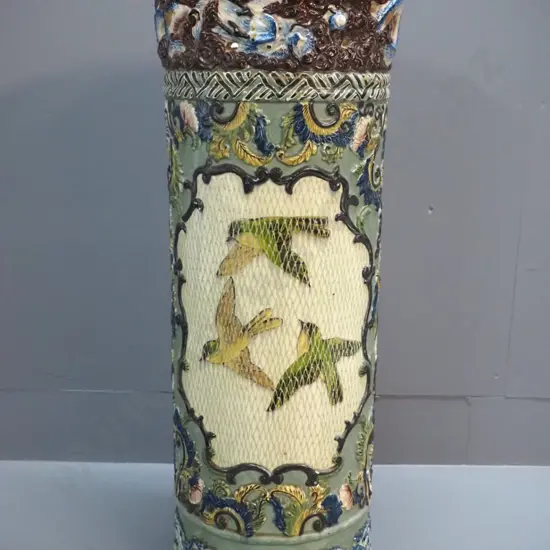 vintage Majolica style umbrella stand with floral and bird motifs - has hairline crack, chip inside rim, some glaze loss