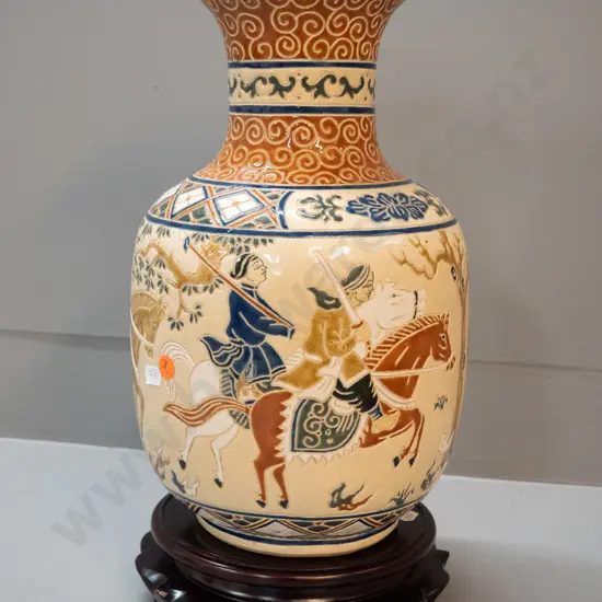 Vietnamese relief pattern vase on carved wooden stand - vase marked Saigon on base. Hairline crack, glaze fleck on rim.