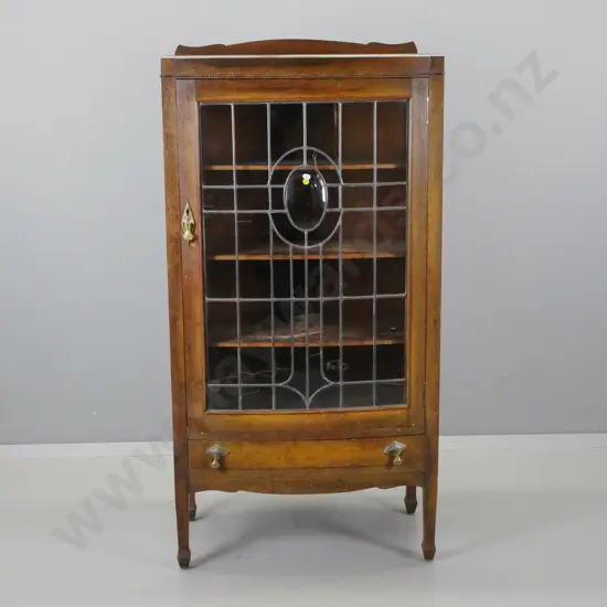 art deco oak bowed front display cabinet with leadlight door with oval slumped glass medallion, 3 fixed shelves, lower