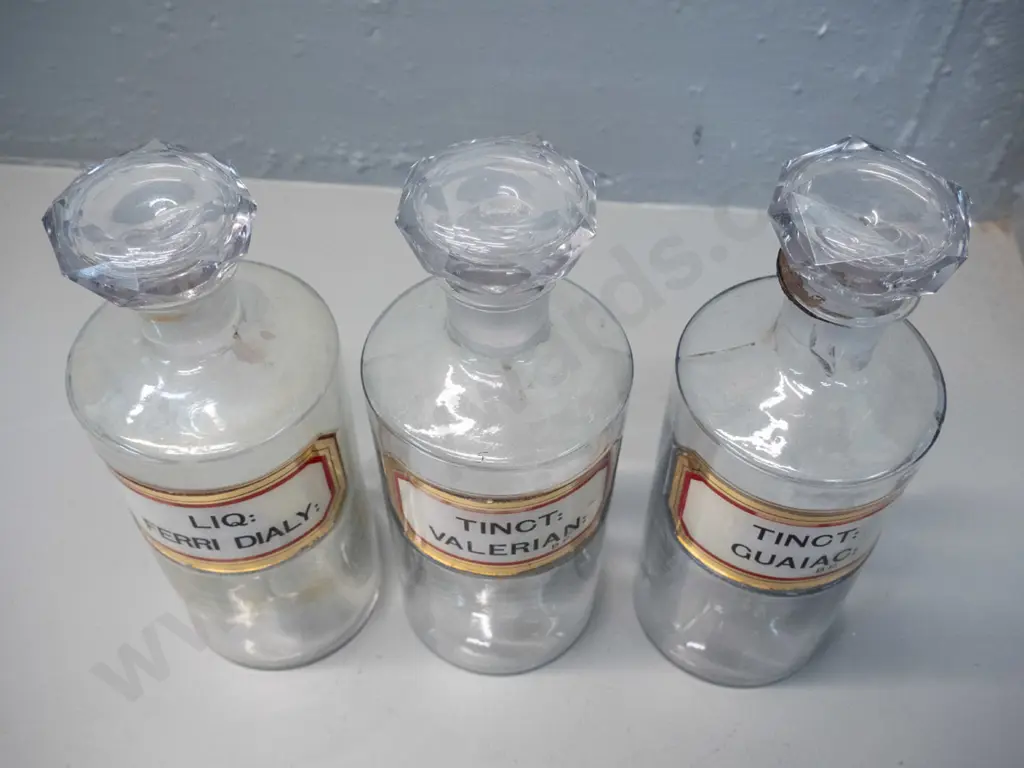 3 clear glass stoppered apothecary bottles with labels H-240 D-90 Image 1++