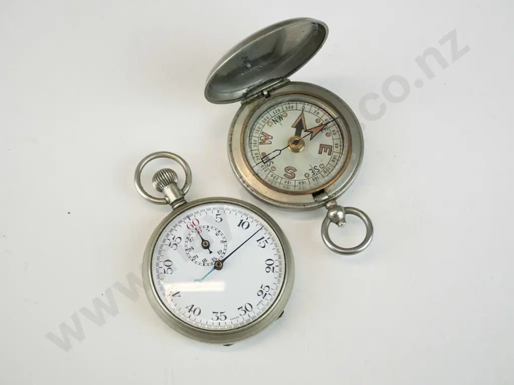 stopwatch marked Swiss Made and a pocket compass marked F. Barker & Co London 1917 Image 1++