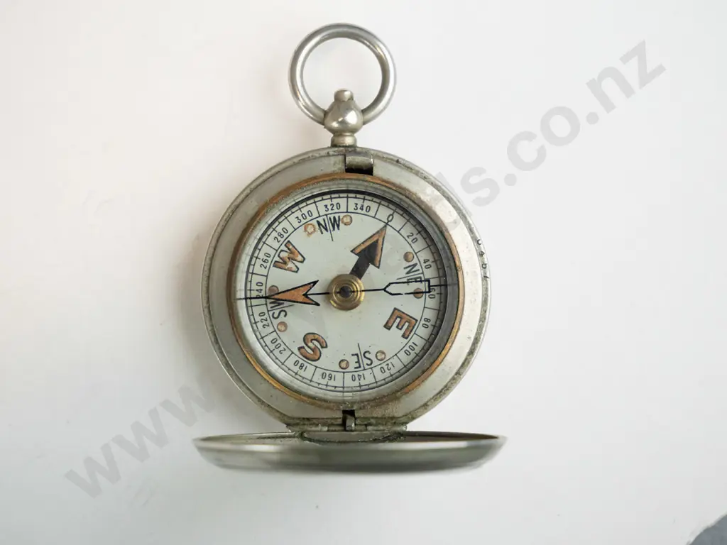 stopwatch marked Swiss Made and a pocket compass marked F. Barker & Co London 1917 Image 1++
