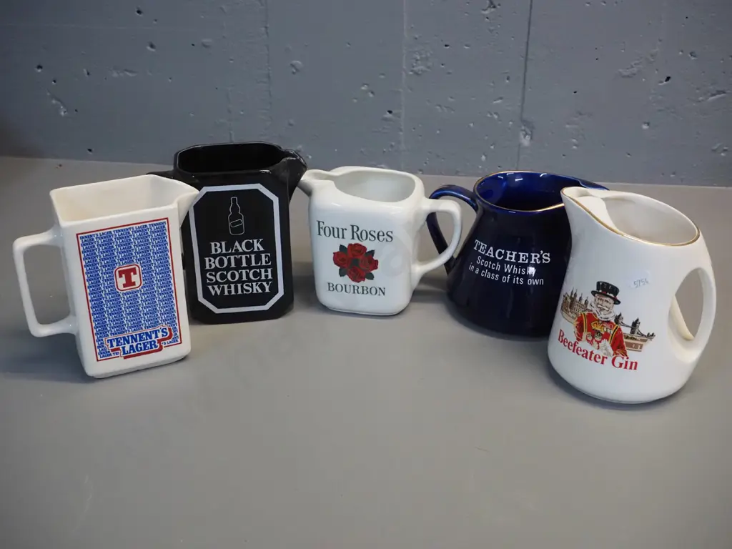 5 Scotch hisky, bourbon, gin and beer jugs, 3 by Wade, one Arabia Finland, one has no mark. Tallest is H150 Image 1++