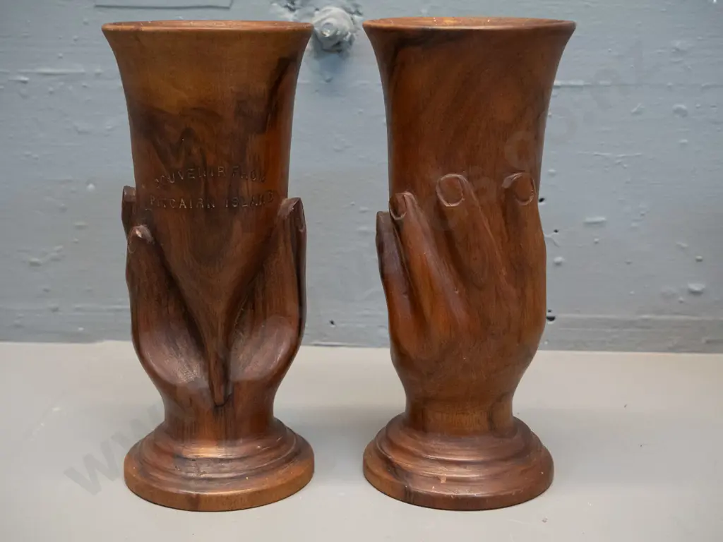 pair of hand carved timber cups or vases with relief hands, each marked 'Souvenir of Pitcairn Island' H-205 Image 1++