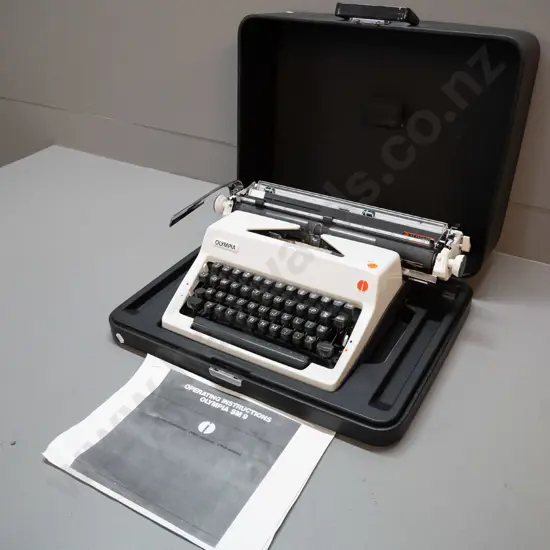 Olympia SM-9 portable typewriter with integrated hard plastic case. Case is H-180 W-460 D-370