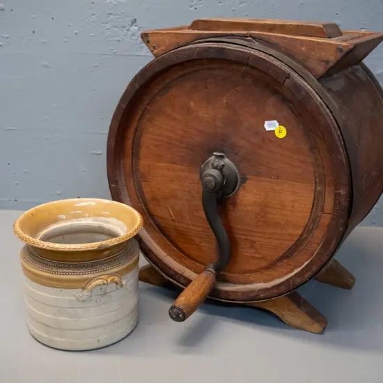 vintage timber butter churn with cast iron banding and handle and a small stoneware crock with chip to one handle. Some