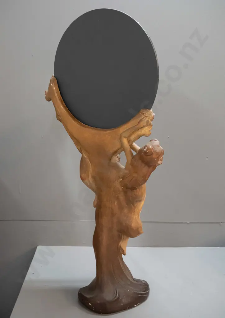 nouveau style porcelain figurine of two women holding round bevelled mirror, on NZ mixed timber pedestal. Some glaze Image 1++
