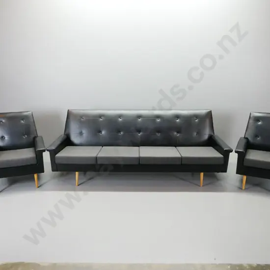 retro 3 piece black button-back vinyl and fabric lounge suite with 4 seater settee and 2 armchairs, beech front legs.