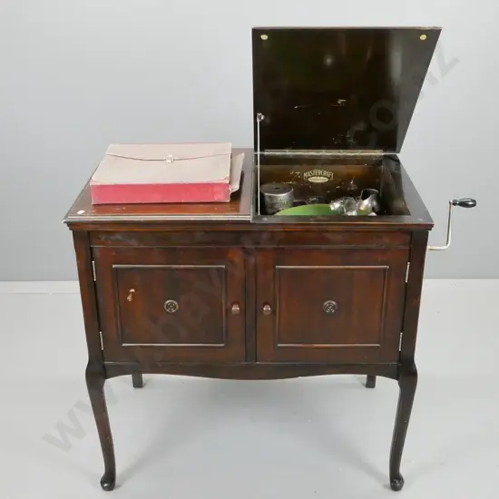 vintage restorer's gramophone in mabhogany cabinet, 2 doors, one side with record storage, other wide fabric backed