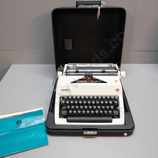 Olympia SM portable typewriter with integrated hard plastic case. Case is H-170 W-370 D-370