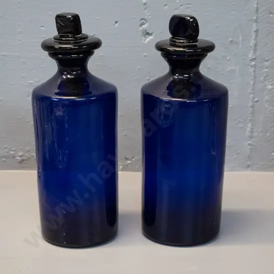 two cobalt blue glass bottles with large stoppers - some chips to inner base of stoppers H240 D90