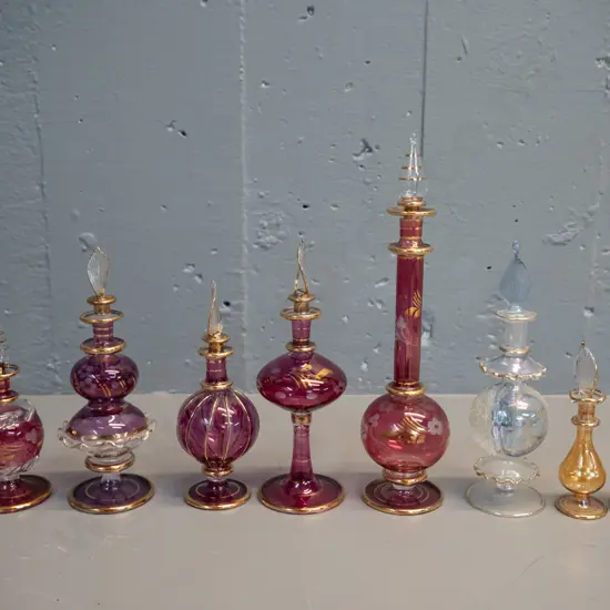 8 fine glass stoppered scent bottles, 5 in boxes marked Made in Egypt, tallest is H-240