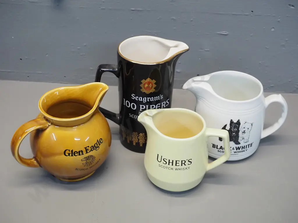 4 Scotch whisky water jugs - 3 made by Wade, Black & White by HCW Burleigh, tallest is H170 Image 1++