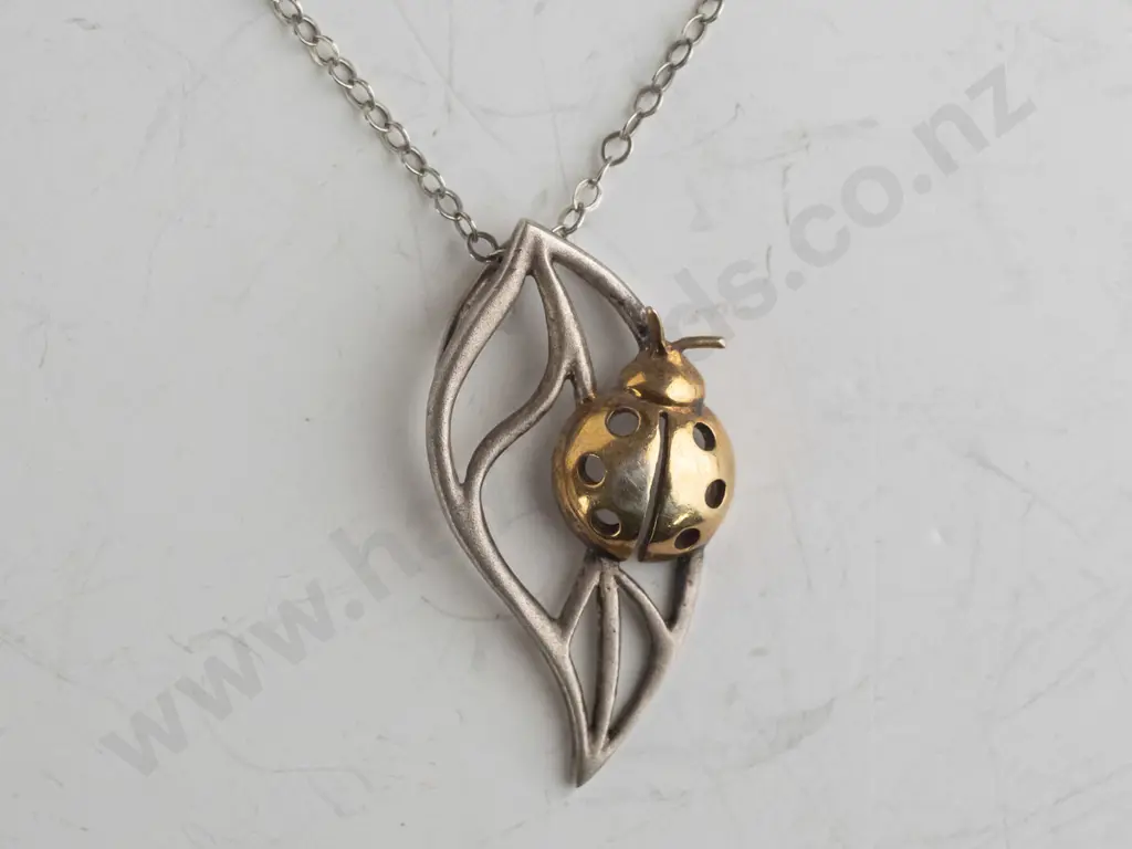 silver ladybug on leaf necklace stamped 925 Image 1++