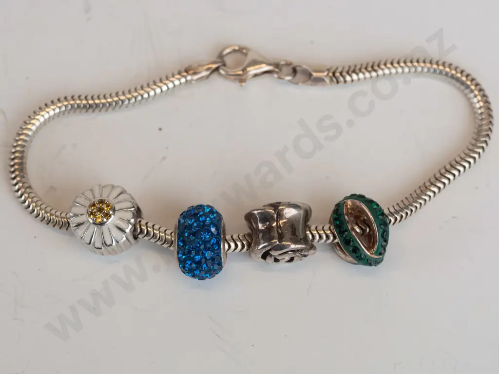 silver bracelet with 4 charms stamped 925 Image 1++