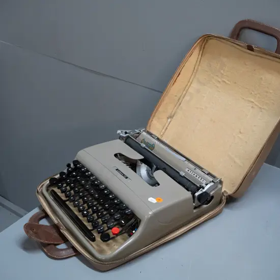 Olivetti Lettera portable typewriter with integrated case. Case when closed is H-100 W-290 D-330
