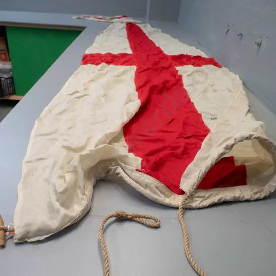 large pennant shaped maritime signal flag with rope and toggle - red cross on white, has wear and holes L-3800