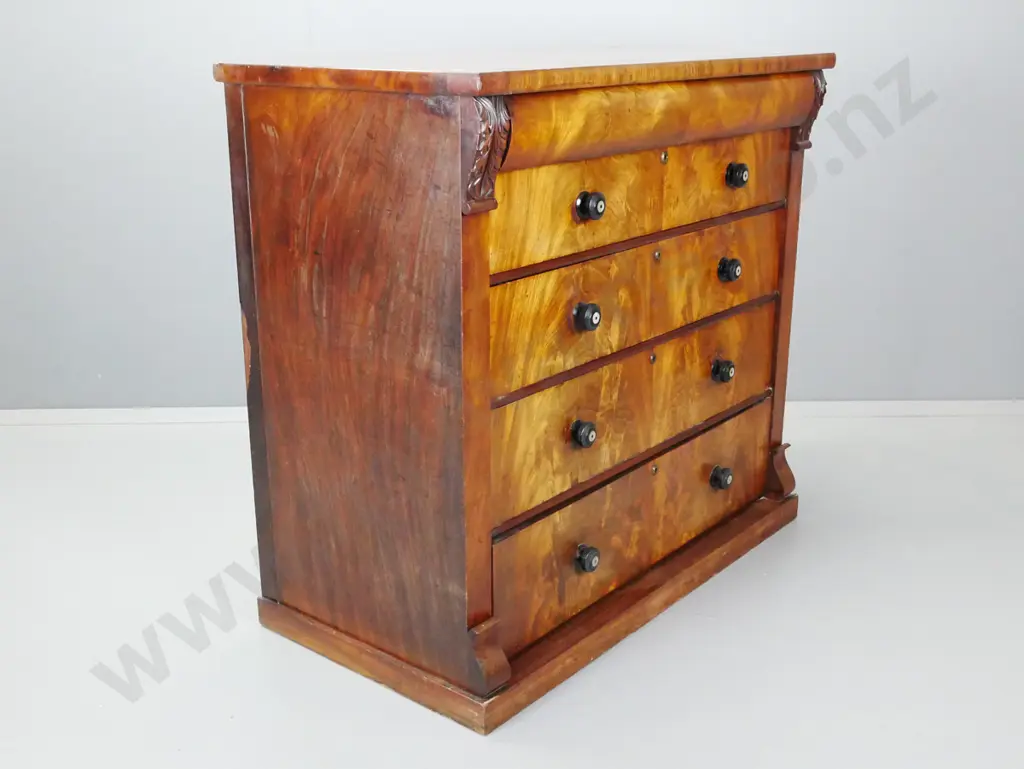 Victorian mahogany 5-drawer with shaped top drawer, flame mahogany fronts, turned knobs with mother of pearl Image 1++