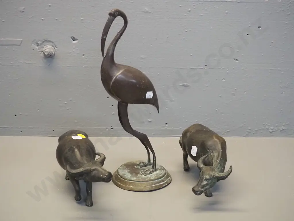 3 cast metal animal figures - ibis H-300 and 2 water buffalo, one of which has trouble standing up Image 1++
