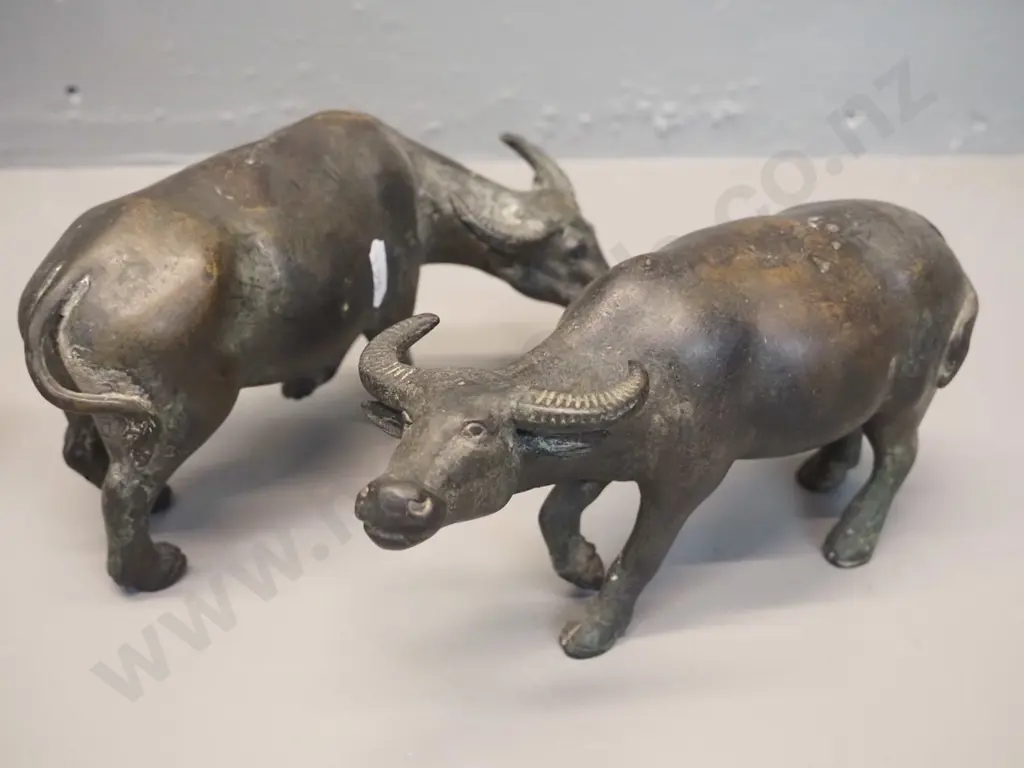 3 cast metal animal figures - ibis H-300 and 2 water buffalo, one of which has trouble standing up Image 1++