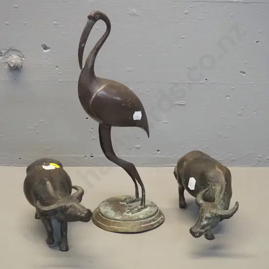 3 cast metal animal figures - ibis H-300 and 2 water buffalo, one of which has trouble standing up