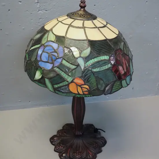 reproduction Tiffany style leadlight table lamp - floral motif shade, cast metal base. Cord has been cut, needs rewiring