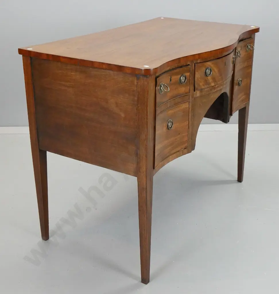 Regency mahogany serpentine fronted sideboard w/3 drawers with ring handles, square tapered legs - remnants of BADA seal Image 1++