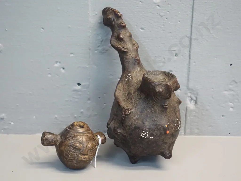 2 African items - small carved Songe pipe L90 and Mangbetu gourd fashioned pipe with inset decoration L230 W140 Image 1++