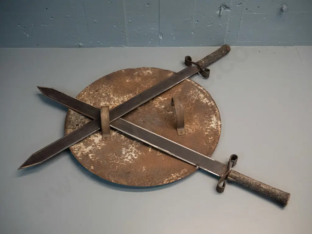 decorative shield and crossed swords - iron with beaten brass star, timber tree branch handles H-800 W-760 Image 1++