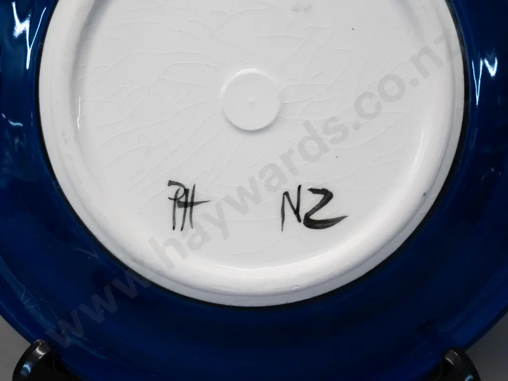 2 studio pottery items - Catherine Anselmi vase H-220 and a kiwi themed plated marked "PH" D-250 Image 1++