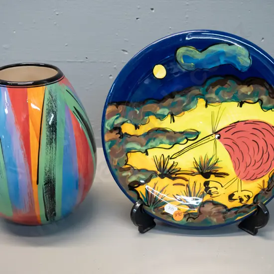 2 studio pottery items - Catherine Anselmi vase H-220 and a kiwi themed plated marked "PH" D-250