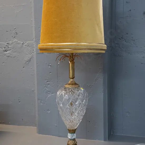 brass and cut crystal table lamp with gold corded velvet shade. Some discolouration to brass, cracks to small crystal