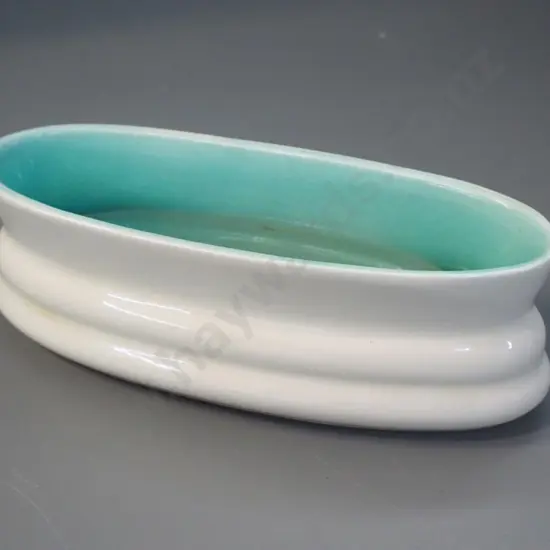 O.C. Stephens trough vase with cream exterior, teal inner H-80 L-220
