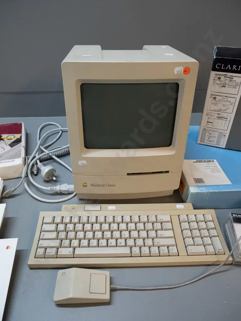 circa 1990 Apple Macintosh Classic model M0420 computer with keyboard, mouse, assorted software, diskettes, etc. Image 1++