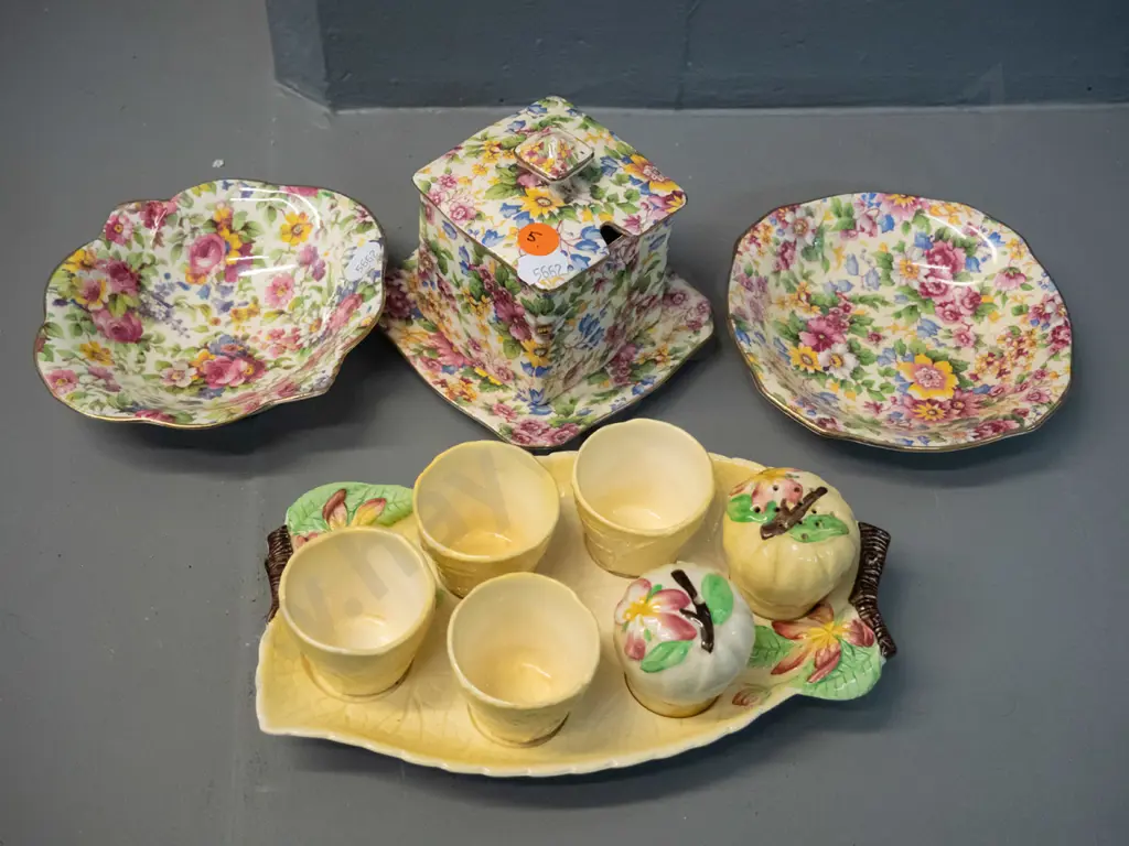 3 pieces Royal Winton all-over-floral, 2 are "Cheadle" pattern, and a Carlton Ware eggcup set in "Apple Blossom" pattern Image 1++