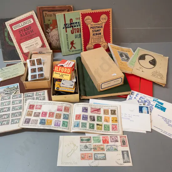 large collection of vintage stamp albums, loose stamps, some first day covers, and a small box of photo corners,